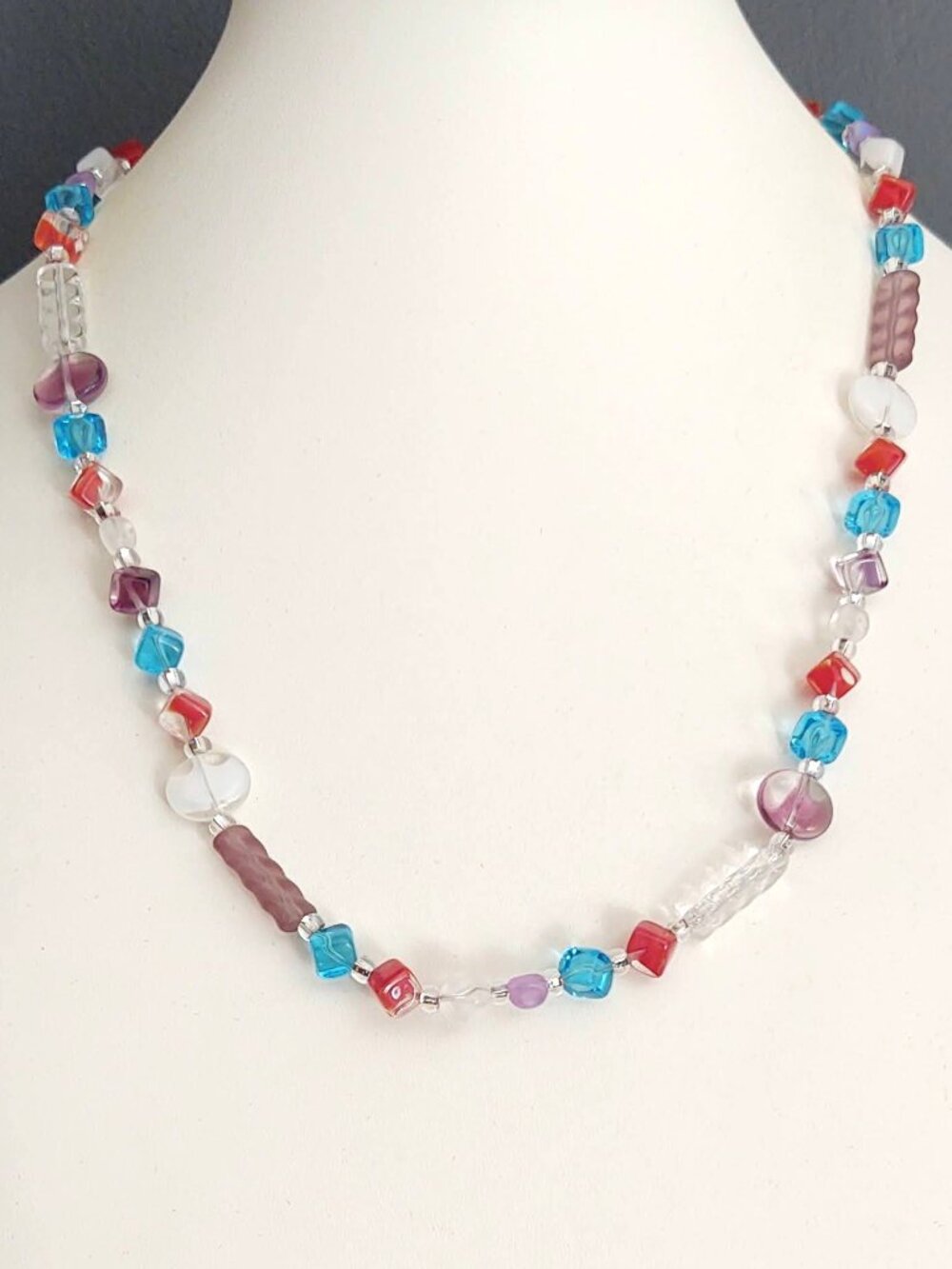 Blue, clear, mauve, red and purple glass necklace